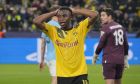 Dortmund's Youssoufa Moukoko reacts after a missed scoring opportunity during the Champions League Group G soccer match between Borussia Dortmund and Manchester City in Dortmund, Germany, Tuesday, Oct. 25, 2022. (AP Photo/Martin Meissner)