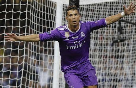 Real Madrid's Cristiano Ronaldo celebrates after scoring during the Champions League final soccer match between Juventus and Real Madrid at the Millennium Stadium in Cardiff, Wales, Saturday June 3, 2017. (AP Photo/Kirsty Wigglesworth)
