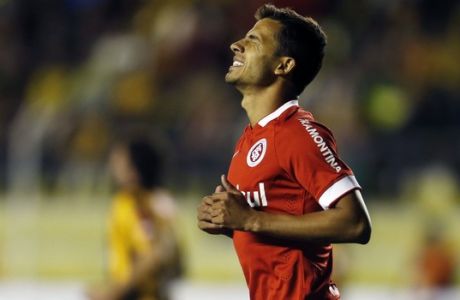 Nilmar of Brazil's Internacional reacts after missing a chance to score against Bolivia's The Strongest during a Copa Libertadores soccer match in La Paz, Bolivia, Tuesday, Feb. 17, 2015. (AP Photo/Juan Karita)