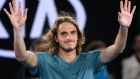 Greece's Stefanos Tsitsipas celebrates after defeating Switzerland's Roger Federer in their fourth round match at the Australian Open tennis championships in Melbourne, Australia, Sunday, Jan. 20, 2019. (AP Photo/Mark Schiefelbein)