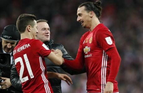 United's Zlatan Ibrahimovic, celebrates with Ander Herrera and Wayne Rooney, center, at the end of the English League Cup final soccer match between Manchester United and Southampton FC at Wembley stadium in London, Sunday, Feb. 26, 2017. United won 3-2. (AP Photo/Kirsty Wigglesworth)