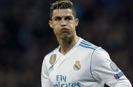 Real Madrid's Cristiano Ronaldo reacts during a Champions League Round of 16 first leg soccer match between Real Madrid and Paris Saint Germain at the Santiago Bernabeu stadium in Madrid, Spain, Wednesday, Feb. 14, 2018. (AP Photo/Francisco Seco)