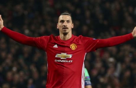 Manchester United's Zlatan Ibrahimovic celebrates after scoring during the Europa League round of 32 first leg soccer match between Manchester United and St.-Etienne at the Old Trafford stadium in Manchester, England, Thursday, Feb. 16, 2017 . (AP Photo/Dave Thompson)