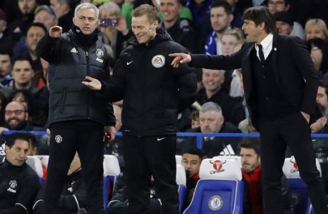 United manager Jose Mourinho, left, and Chelsea's team manager Antonio Conte, right, gesture during the English FA Cup quarterfinal soccer match between Chelsea and Manchester United at Stamford Bridge stadium in London, Monday, March 13, 2017. (AP Photo/Frank Augstein)