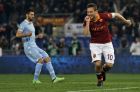 AS Roma forward Francesco Totti celebrates after scoring during a Serie A soccer match between AS Roma and Lazio at Rome's Olympic stadium, Sunday, April 8, 2013. (AP Photo/Alessandra Tarantino)