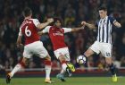 West Bromwich Albion's Gareth Barry, right, in action with Arsenal's Mohamed Elnenar, centre, during their English Premier League soccer match between Arsenal and West Bromwich Albion at the Emirates stadium in London Monday, Sept. 25, 2017. (AP Photo/Alastair Grant)