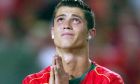 Portugal's Cristiano Ronaldo reacts after missing a scoring chance during the Euro 2004 soccer championship final match between Portugal and Greece at the Luz stadium in Lisbon, Portugal, Sunday, July 4, 2004. (AP Photo/Thomas Kienzle) ** FOR EDITORIAL USE ONLY NO WIRELESS COMMERCIAL OR PROMOTIONAL LICENSING PERMITTED **