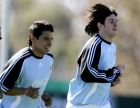 Argentina's Javier Saviola, left, and Lionel Messi, jog during a training session in Buenos Aires, Argentina, Monday May 22, 2006. The Argentine team began preparing for the 2006 FIFA World Cup in Germany which starts next month. Argentina will play in group "C"  with Ivory Coast, Serbia and Montenegro and the Netherlands. (AP Photo/Natacha Pisarenko)