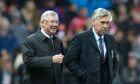 Great Britain and Ireland's manager Sir Alex Ferguson takes to the touchline alongside The Rest of the World's manager Carlo Ancelotti before the Unicef Match for Children charity football match between a Great Britain and Ireland team and a Rest of the World team at Old Trafford Stadium, Manchester, England, Saturday, Nov. 14, 2015. (AP Photo/Jon Super)  