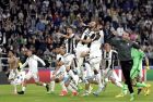Juventus' Gonzalo Higuain, top center, raises a fist as he and his teammates celebrate after the Champions League semi final second leg soccer match between Juventus and Monaco in Turin, Italy, Tuesday, May 9, 2017. Juventus defeated Monaco by 2-1. (AP Photo/Antonio Calanni)