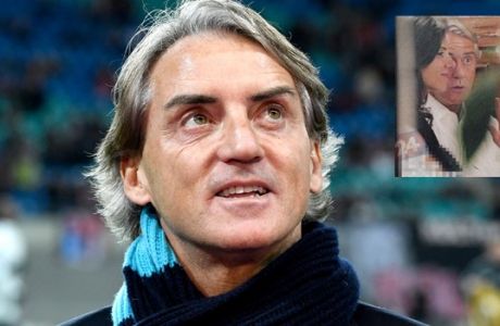 FILE - in this Thursday, March 8, 2018 file photo, Zenit St. Petersburg manager Roberto Mancini looks up prior to the Europa League round of sixteen first leg soccer match between RB Leipzig and FC Zenit St. Petersburg in Leipzig, Germany. Roberto Mancini is the top candidate to become Italy's coach after Carlo Ancelotti reportedly turned down the job. Mancini tells RAI state radio, "There has not been contact with the (Italian football) federation but for a coaching the Italian national team would be source of honor and prestige." Italian media reported over the weekend that Ancelotti informed the federation that he was no longer interested. (AP Photo/Jens Meyer, File)