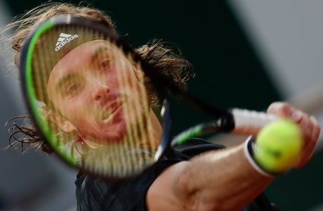 Greece's Stefanos Tsitsipas plays a shot against Russia's Andrey Rublev in the quarterfinal match of the French Open tennis tournament at the Roland Garros stadium in Paris, France, Wednesday, Oct. 7, 2020. (AP Photo/Alessandra Tarantino)
