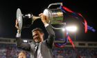 Barcelona's head coach Luis Enrique holds up the cup after winning the Copa del Rey final soccer match between Barcelona and Alaves at the Vicente Calderon stadium in Madrid, Spain, Saturday May 27, 2017. (AP Photo/Daniel Ochoa de Olza)