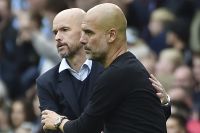 Manchester City's head coach Pep Guardiola, right, cheers with Manchester United's head coach Erik ten Hag at the end of the English Premier League soccer match between Manchester City and Manchester United at Etihad stadium in Manchester, England, Sunday, Oct. 2, 2022. (AP Photo/Rui Vieira)