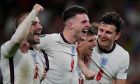England players, from left, England's Luke Shaw, England's Declan Rice, England's Mason Mount and England's Harry Maguire, celebrate after winning during the Euro 2020 soccer championship semifinal match between England and Denmark at Wembley stadium in London, Wednesday,July 7, 2021. (AP Photo/Frank Augstein,Pool)