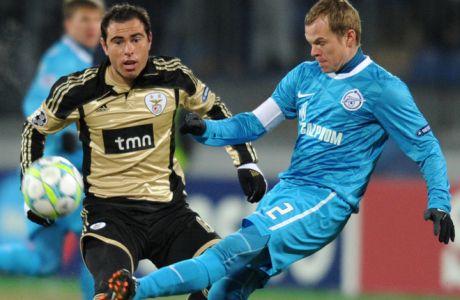 Aleksandr Anyukov (R) of FC Zenit St Petersburg fights for the ball against Bruno Cesar of SL Benfica  during their UEFA Champions League, round of 16, first legs match in Saint-Petersburg, on February 15, 2012. AFP PHOTO / KIRILL KUDRYAVTSEV (Photo credit should read KIRILL KUDRYAVTSEV/AFP/Getty Images)