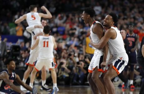 Virginia players celebrate at the end of a semifinal round game against Auburn in the Final Four NCAA college basketball tournament, Saturday, April 6, 2019, in Minneapolis. (AP Photo/Charlie Neibergall)