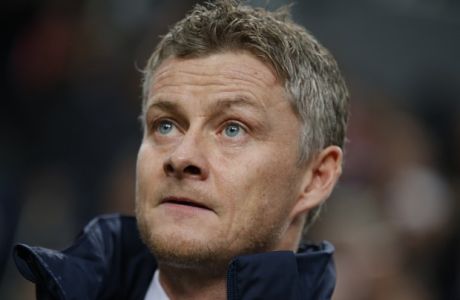 Moldes head coach Ole Gunnar Solskjaer  watches his players line up prior to the group A Europa League soccer match between Ajax and Molde at the ArenA stadium in Amsterdam, Netherlands, Thursday, Dec. 10, 2015. (AP Photo/Peter Dejong)