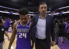Sacramento Kings guard Buddy Hield, left, and Vlade Divac, the Kings vice president of basketball operations and general manager walk off the court together after the Kings defeated the Houston Rockets 96-83 in an NBA basketball game, Wednesday, April 11, 2018, in Sacramento, Calif. (AP Photo/Rich Pedroncelli)