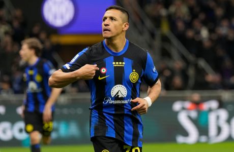 Inter Milan's Alexis Sanchez celebrates after scoring his side's second goal during the Serie A soccer match between Inter Milan and Empoli at the San Siro Stadium, in Milan, Italy, Monday, April 1, 2024. (AP Photo/Antonio Calanni)