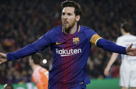 Barcelona's Lionel Messi celebrates after scoring his side's third goal during the Champions League round of sixteen second leg soccer match between FC Barcelona and Chelsea at the Camp Nou stadium in Barcelona, Spain, Wednesday, March 14, 2018. (AP Photo/Emilio Morenatti)