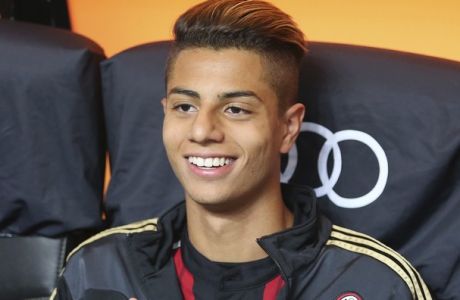 AC Milan midfielder Hachim Mastour smiles prior to the start of the Serie A soccer match between AC Milan and Sassuolo at the San Siro stadium in Milan, Italy, Sunday, May 18, 2014. (AP Photo/Antonio Calanni)