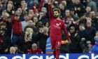 Liverpool's Mohamed Salah celebrates after scoring his side's opening goal during the English Premier League soccer match between Liverpool and Manchester City at Anfield stadium in Liverpool, Sunday, Oct. 16, 2022. (AP Photo/Jon Super)