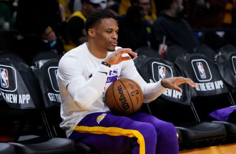 Los Angeles Lakers' Russell Westbrook dances to the music during warmups for the team's NBA basketball game against the Boston Celtics Tuesday, Dec. 13, 2022, in Los Angeles. (AP Photo/Jae C. Hong)