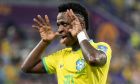 Brazil's Vinicius Junior celebrates after scoring a disallowed goal during the World Cup group G soccer match between Brazil and Switzerland, at the Stadium 974 in Doha, Qatar, Monday, Nov. 28, 2022. (AP Photo/Andre Penner)