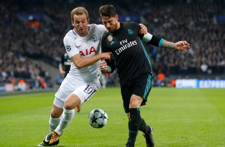 Tottenham's Harry Kane, left, and Real Madrid's Sergio Ramos challenge for the ball during the soccer Champions League group H match between Tottenham and Real Madrid in London, Wednesday, Nov. 1, 2017. (AP Photo/Frank Augstein)