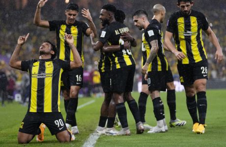 Al Ittihad's Romarinho, left, celebrates with teammates after scoring the opening goal during the Soccer Club World Cup first round soccer match between Al Ittihad and Auckland City FC at King Abdullah Sports City stadium in Jeddah, Saudi Arabia, Tuesday, Dec. 12, 2023. (AP Photo/Manu Fernandez)