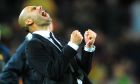 FC Barcelona's coach Josep Guardiola celebrates during a semi final, 2nd leg Champions League soccer match against  Real Madrid at the Camp Nou stadium in Barcelona on Tuesday, May 3, 2011. (AP Photo/Manu Fernandez)