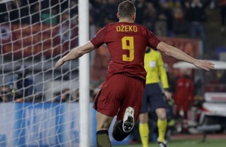 Roma's Edin Dzeko celebrates after scoring his side's opening goal after scoring his side's opening goalduring a Champions League round of 16 second-leg soccer match between Roma and Shakhtar Donetsk, at the Rome Olympic stadium, Tuesday, March 13, 2018. (AP Photo/Gregorio Borgia)