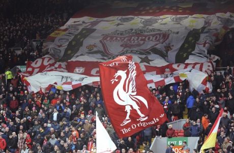 Liverpool fans display banners to show support for their team during the English Premier League soccer match between Liverpool and Tottenham Hotspur at Anfield, Liverpool, England, Sunday, Feb. 4, 2018. (AP Photo/Rui Vieira)
