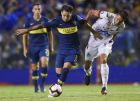 Mauro Zarate of Argentina's Boca Juniors, center, fights for the ball with Larry Vasquez of Colombia's Deportes Tolima during a Copa Libertadores soccer match in Buenos Aires, Argentina, Tuesday, March 12, 2019. (AP Photo/Gustavo Garello)
