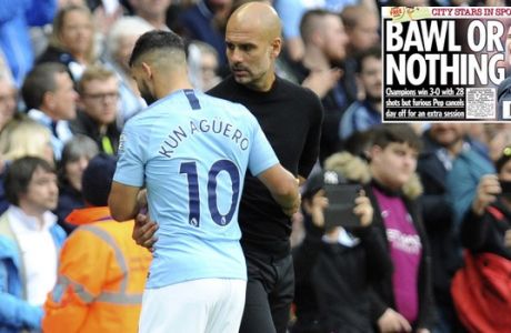 Manchester City's Sergio Aguero, left, reacts with Manchester City manager Josep Guardiola after being substituted by Manchester City's Gabriel Jesus during the English Premier League soccer match between Manchester City and Fulham at Etihad stadium in Manchester, England, Saturday, Sept. 15, 2018. (AP Photo/Rui Vieira)