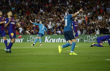 Real Madrid's Cristiano Ronaldo, center, celebrates after scoring during the Spanish Supercup, first leg, soccer match against FC Barcelona at Camp Nou stadium in Barcelona, Spain, Sunday, Aug. 13, 2017. (AP Photo/Manu Fernandez)