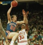 New York Knicks' Kiki Vandeweghe (55) goes for two points over Chicago's Scottie Pippen (33) during first quarter NBA action at Chicago Stadium, May 13, 1989.  (AP Photo/Fred Jewell)