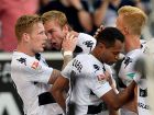 Moenchengladbach's midfielder Andre Hahn celebrates scoring the 1:0 with his teammates during the German first division Bundesliga football match of Borussia Moenchengladbach vs Bayer 04 Leverkusen in Moenchengladbach, western Germany, on August 27, 2016.  / AFP / SASCHA SCHUERMANN / RESTRICTIONS: DURING MATCH TIME: DFL RULES TO LIMIT THE ONLINE USAGE TO 15 PICTURES PER MATCH AND FORBID IMAGE SEQUENCES TO SIMULATE VIDEO. == RESTRICTED TO EDITORIAL USE == FOR FURTHER QUERIES PLEASE CONTACT DFL DIRECTLY AT + 49 69 650050
        (Photo credit should read SASCHA SCHUERMANN/AFP/Getty Images)
