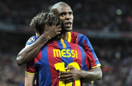 Lionel Messi and Eric Abidal of Barcelona celebrate David Villa's goal during the 2011 UEFA Champions League Final between Barcelona and Manchester United at Wembley Stadium in London, United Kingdom. (Photo by ben radford/Corbis via Getty Images)