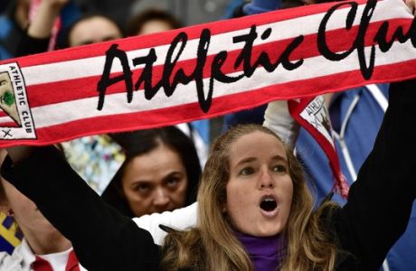 A Athletic Bilbao's fan cheers her team during the Spanish La Liga soccer match between Real Madrid and Athletic Bilbao, at San Mames stadium, in Bilbao, northern Spain, Saturday, March 18, 2017. Real Madrid won the match 2-1. (AP Photo/Alvaro Barrientos)