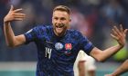 Slovakia's Milan Skriniar celebrates after scoring his side's second goal during the Euro 2020 soccer championship group E match between Poland and Slovakia at Gazprom arena stadium in St. Petersburg, Russia, Monday, June 14, 2021. (Kirill Kudryavtsev/Pool via AP)