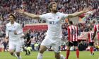 Swansea City's Fernando Llorente celebrates scoring his side's first goal of the game,  during the English Premier League soccer match between Sunderland and Swansea City, at the Stadium of Light, in Sunderland, England, Saturday May 13, 2017. (Owen Humphreys/PA via AP)