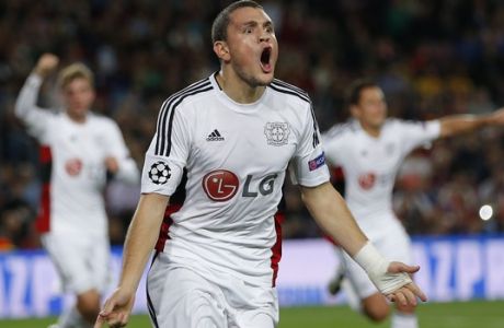 Leverkusen's Kyriakos Papadopoulos celebrates after scoring the opening goal of his team during a Champions League Group E soccer match between Barcelona and Bayer Leverkusen at Camp Nou stadium in Barcelona, Spain, Tuesday, Sept. 29, 2015. (AP Photo/Emilio Morenatti)
