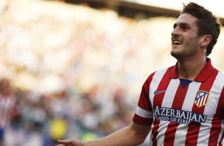 Atletico Madrid's Koke celebrates after scoring a goal against Malaga during their Spanish First Division soccer match at La Rosaleda stadium in Malaga, southern Spain January 4, 2014. REUTERS/Jon Nazca (SPAIN - Tags: SPORT SOCCER) 
Picture Supplied by Action Images