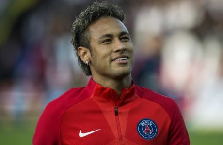 PSG's Neymar warms up before his French League One soccer match against Guingamp at the Roudourou stadium in Guingamp, western France, Sunday, Aug. 13, 2017. Neymar makes his long-awaited debut with Paris Saint-Germain on Sunday in the small Brittany town of Guingamp. (AP Photo/Kamil Zihnioglu)