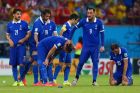 RECIFE, BRAZIL - JUNE 29: (L-R) Konstantinos Katsouranis, Giorgos Samaras, Sokratis Papastathopoulos, Theofanis Gekas, Giorgos Karagounis, Konstantinos Mitroglou and Vasilis Torosidis of Greece react after being defeated by Costa Rica in a penalty shootout during the 2014 FIFA World Cup Brazil Round of 16 match between Costa Rica and Greece at Arena Pernambuco on June 29, 2014 in Recife, Brazil.  (Photo by Quinn Rooney/Getty Images)