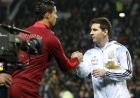 Lionel Messi of Argentina, right, greets Cristiano Ronaldo of Portugal before their International Friendly soccer match at Old Trafford Stadium, Manchester, England, Tuesday Nov. 18, 2014. (AP Photo/Jon Super)  