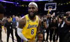 Los Angeles Lakers forward LeBron James celebrates with his daughter Zhuri after passing Kareem Abdul-Jabbar to become the NBA's all-time leading scorer during the second half of an NBA basketball game against the Oklahoma City Thunder Tuesday, Feb. 7, 2023, in Los Angeles.(AP Photo/Ashley Landis)