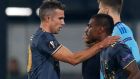 Fenerbahce's Robin van Persie greets his substitute Emmanuel Emenike during the Group A Europa League soccer match between Feyenoord and Fenerbahce at De Kuip stadium in Rotterdam, Thursday, Dec. 8, 2016. (AP Photo/Peter Dejong)